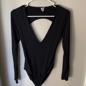 Low cut long sleeve body suit
